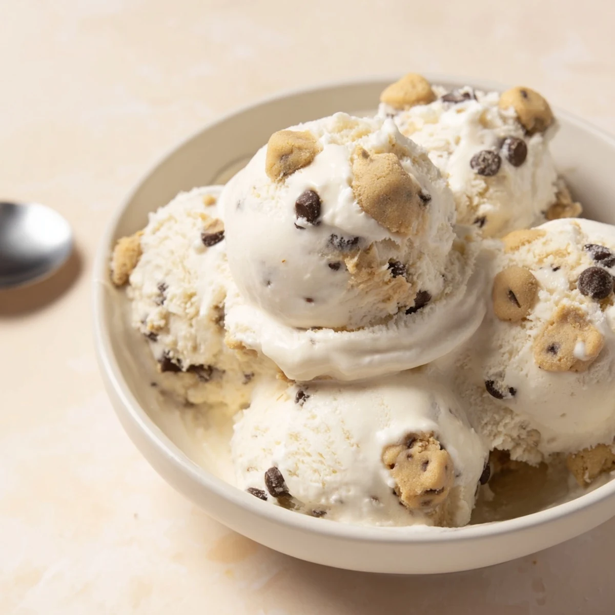 Creamy cottage cheese ice cream swirled with soft chocolate chip cookie dough bites.