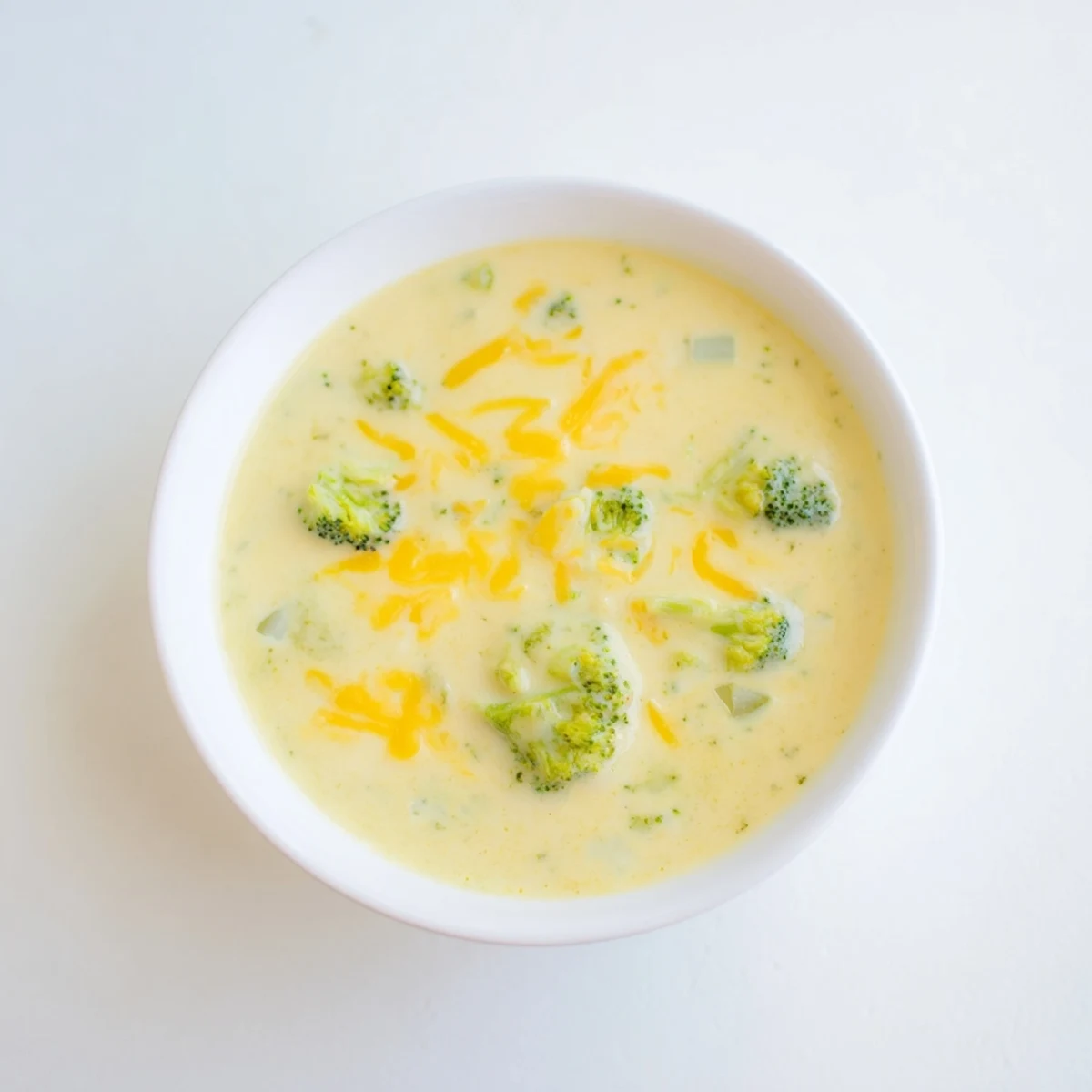 Thick and creamy Broccoli Cheese Soup, garnished and ready, perfect for a cozy, comforting lunch.