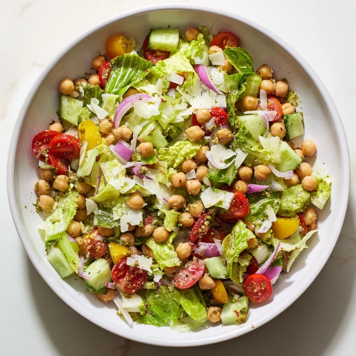 Bright, colorful La Scala Chopped Chickpea Salad, showcasing crisp vegetables and creamy chickpeas in a bowl ready to enjoy.