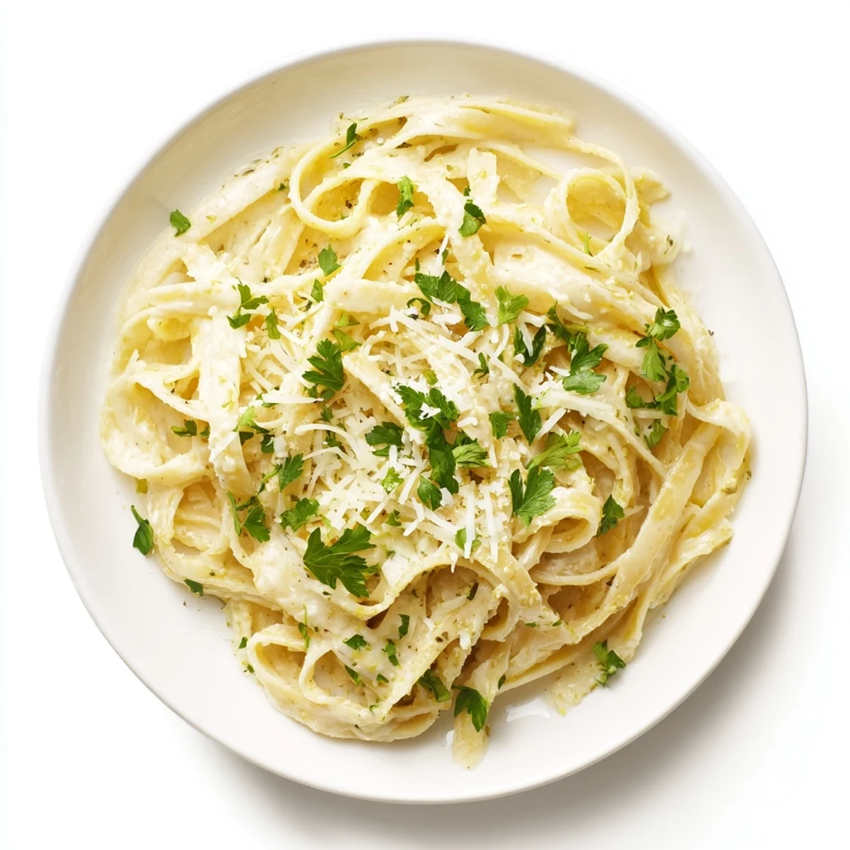 A close-up of delicious Skinny Alfredo Garlic Parmesan Pasta, ready to devour with a sprinkle of fresh parsley.