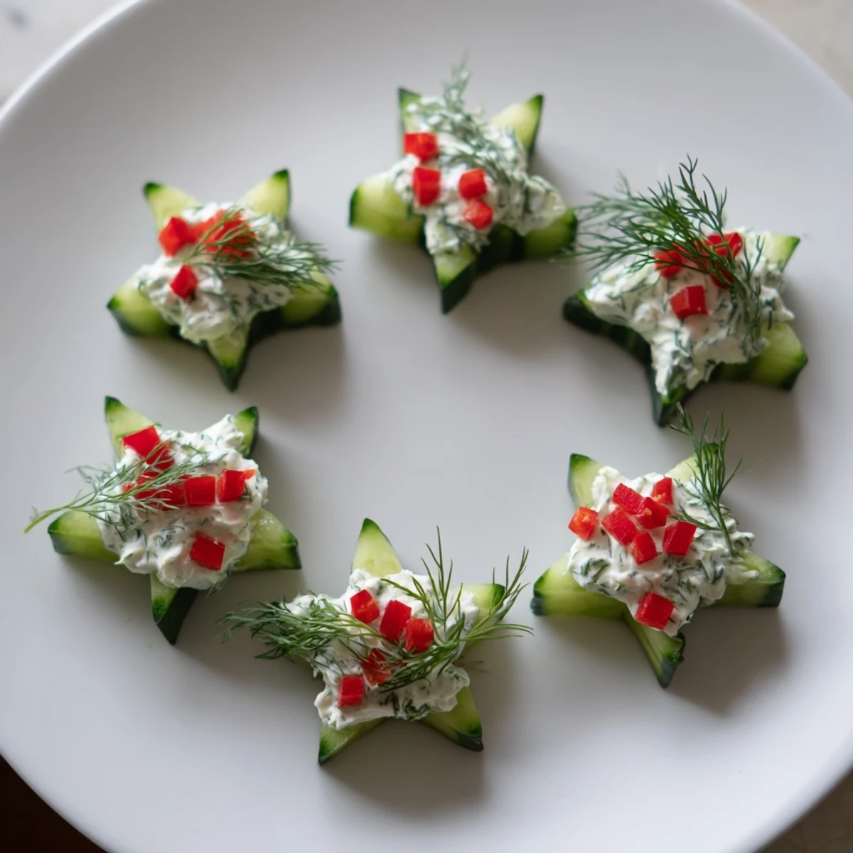 Fresh cucumber and dill Christmas stars, ready to serve, offer a delightful holiday appetizer.