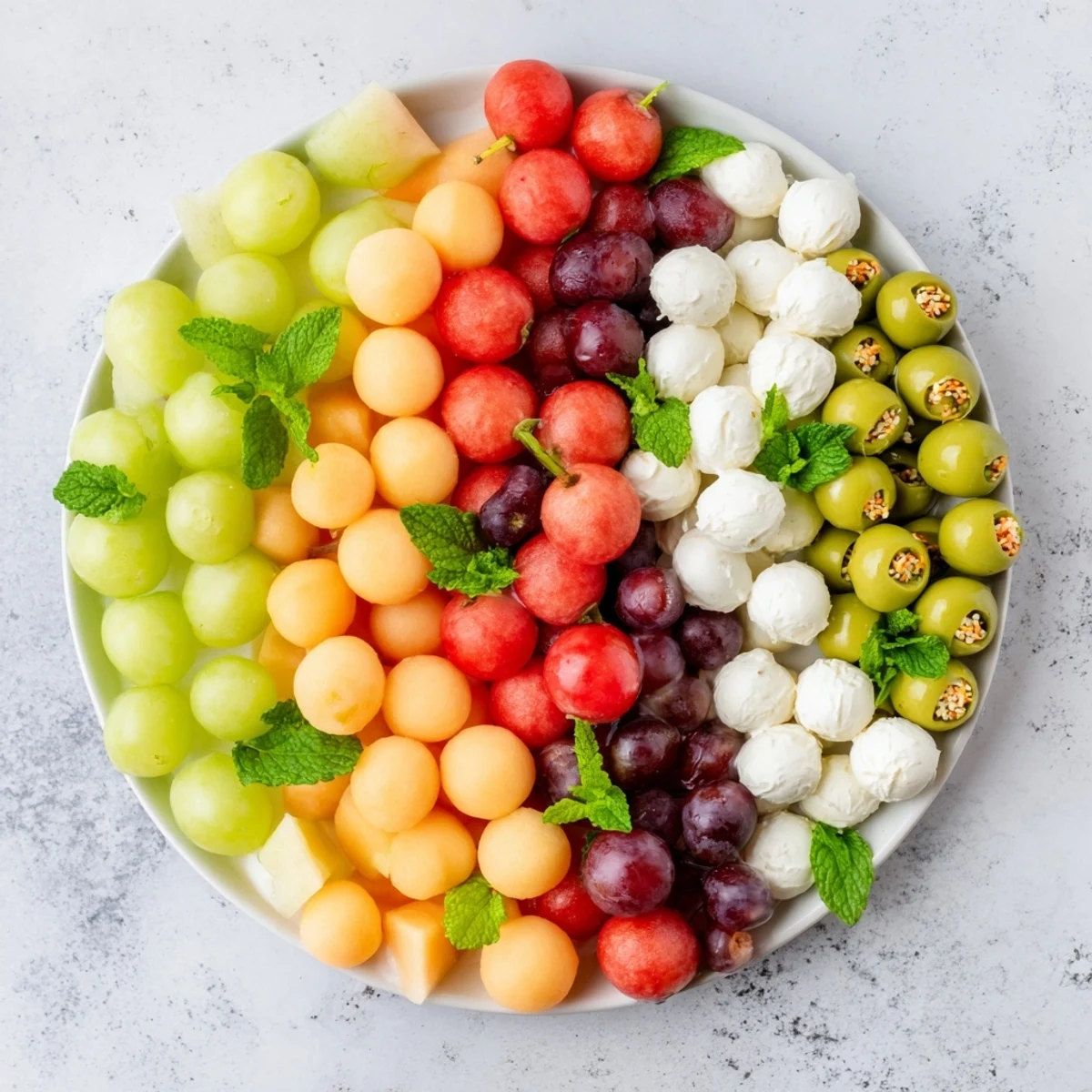 This visually appealing Polka Dot Platter presents a delightful array of spherical appetizers, ready to enjoy.
