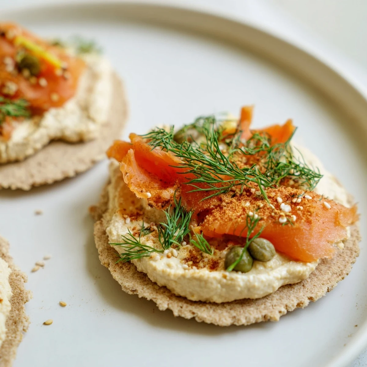 Picture of The Driftwood Beach, a beautiful appetizer with smoked fish amidst a hummus landscape.