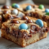 2. Soft and chewy peanut butter cookie bars loaded with Easter egg candies, ideal for festive spring gatherings.  