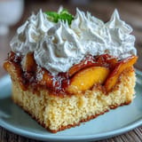 Summer dessert featuring stacked brown butter cornbread shortcakes overflowing with sweet peaches.