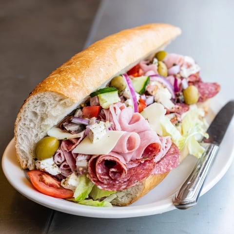 Vibrant Flavor Mash-Up Sandwiches piled high with meats and fresh veggies showcase delicious textures.  