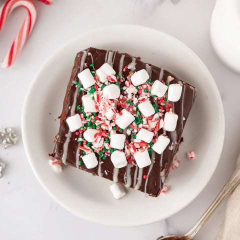 Close-up of decadent Hot Chocolate Bomb Bark, showcasing swirls of white chocolate and marshmallows.
