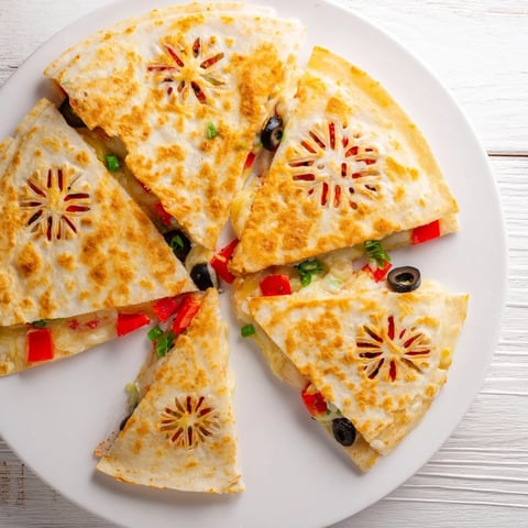 Express Snowflake Quesadillas, a golden, melty cheese delight with crisp snowflake tortilla tops.
