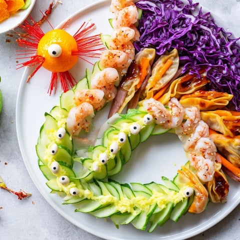 A colorful Mighty Dragon Lunar New Year Board with shrimp, vegetables, and dipping sauces displayed for a holiday feast.