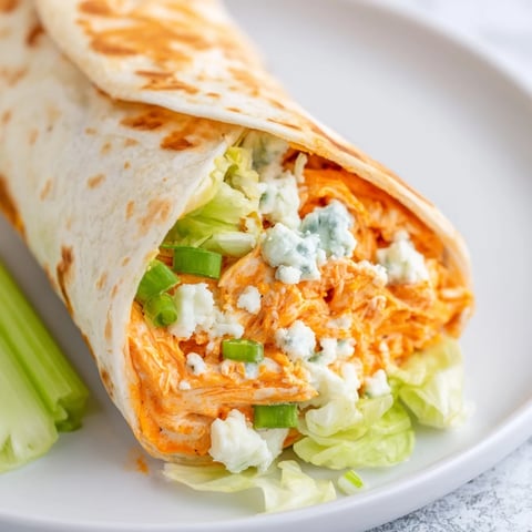 Buffalo Chicken Dip Wraps, loaded with creamy buffalo chicken, wrapped in warm tortilla, ready to eat.