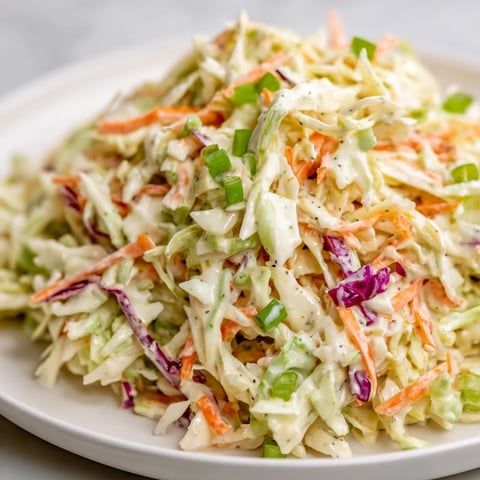 Fresh and vibrant Quick Coleslaw Salad, a colorful mix ready to brighten your plate.