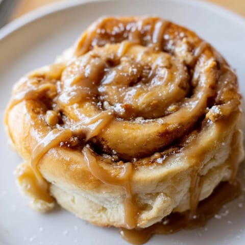 Homemade Peanut Butter Maple Breakfast Rolls, warm from the oven, with a glistening maple glaze.