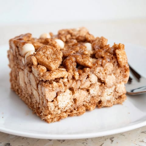 Decadent blondies infused with Cinnamon Toast Crunch flavor, perfect for dessert lovers.  
