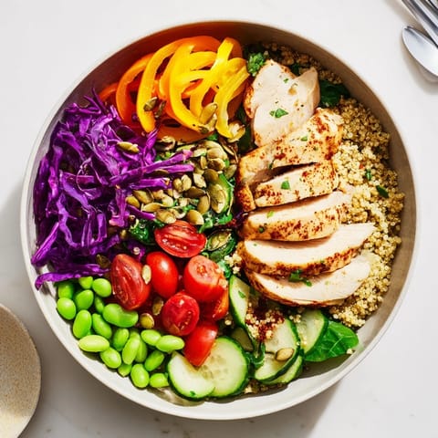 Vibrant meal-prep bowls showcasing layered grains, protein, and colorful garden-fresh veggies.  