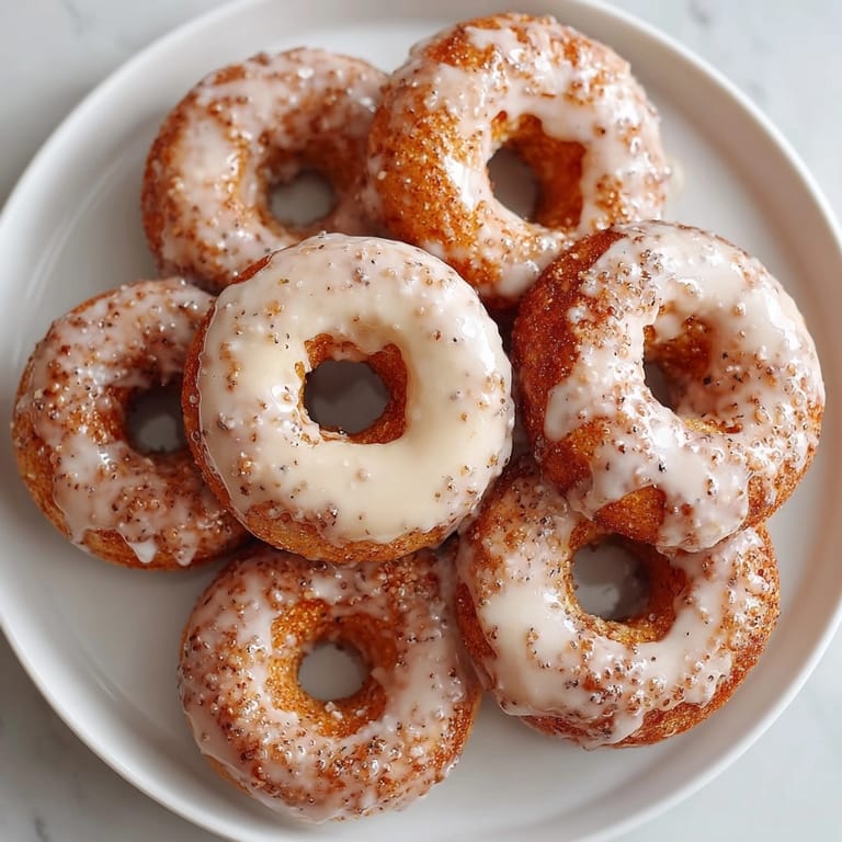 Close-up of homemade apple cider donuts glazed to perfection; a tempting sweet breakfast treat.