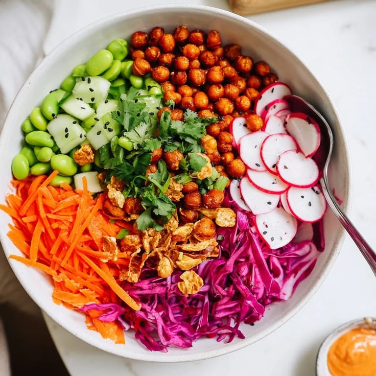 Bright and crunchy ASMR Snack Bowls piled high with edamame and roasted chickpeas.