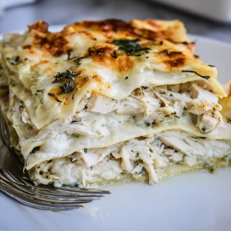 Rustic rosemary chicken lasagna layered with tender chicken and rich béchamel sauce.  