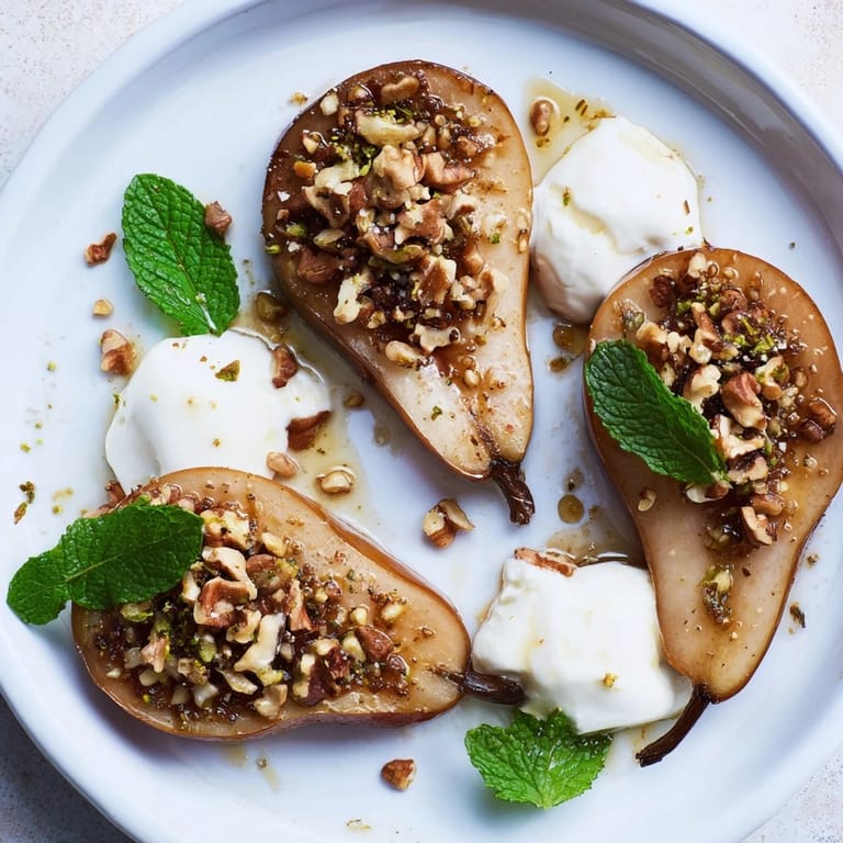 Enjoy a photo of elegant roasted pears, cinnamon-infused with walnuts and a dollop of yogurt.
