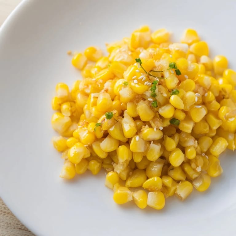 A close-up of fragrant Japanese Butter Corn, highlighting tender kernels and melted garlic butter's sheen.