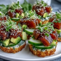 Crispy rice tuna poke cups appetizer, golden fried and piled high with fresh tuna.